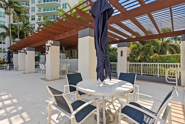 550 SE Mizner Blvd Unit B206, Boca Raton, FL 33432 - view of patio featuring outdoor dining space and a pergola
