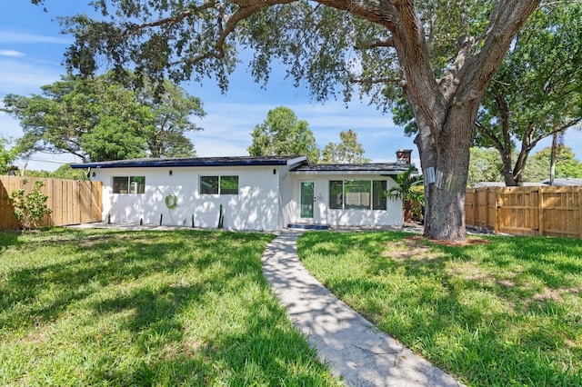 1517 NW 12th Ave, Fort Lauderdale, FL 33311 - ranch-style home with a chimney and stucco siding