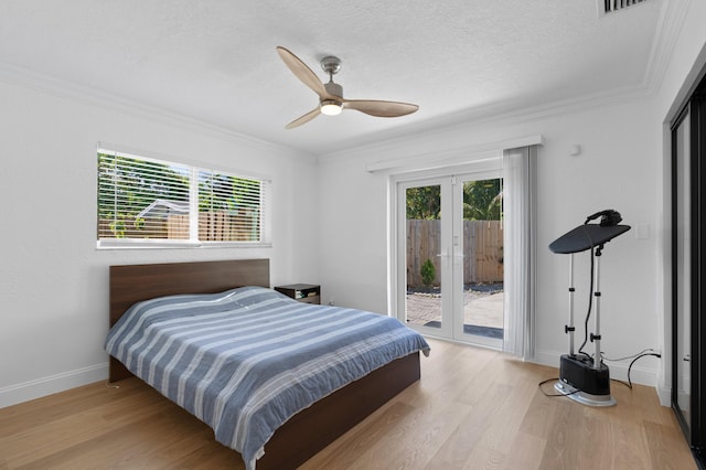 1517 NW 12th Ave, Fort Lauderdale, FL 33311 - bedroom with access to exterior, wood finished floors, french doors, ornamental molding, and multiple windows