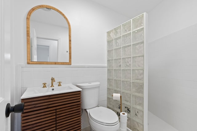 1517 NW 12th Ave, Fort Lauderdale, FL 33311 - full bath with vanity, walk in shower, tile walls, toilet, and a wainscoted wall