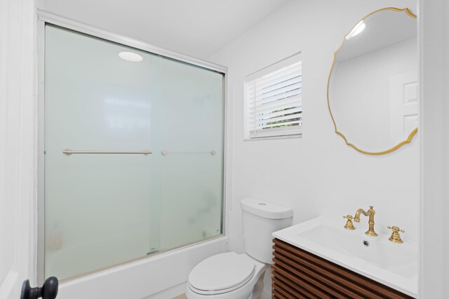 1517 NW 12th Ave, Fort Lauderdale, FL 33311 - bathroom with toilet, vanity, and bath / shower combo with glass door