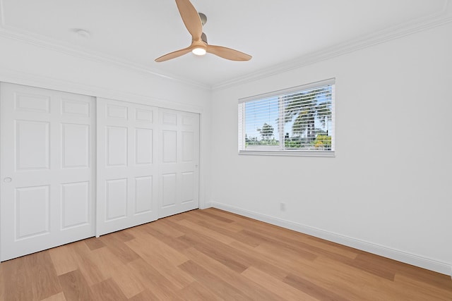 1517 NW 12th Ave, Fort Lauderdale, FL 33311 - unfurnished bedroom with light wood finished floors, a closet, crown molding, baseboards, and ceiling fan