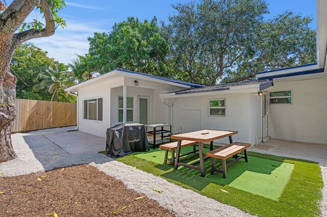 1517 NW 12th Ave, Fort Lauderdale, FL 33311 - rear view of house featuring a patio and stucco siding