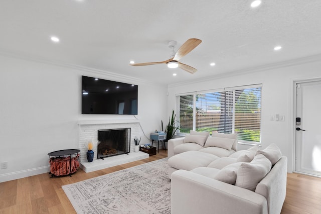 1517 NW 12th Ave, Fort Lauderdale, FL 33311 - living room featuring ornamental molding, a ceiling fan, a brick fireplace, recessed lighting, and wood finished floors