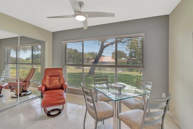5876 Regal Glen Dr Unit 103, Boynton Beach, FL 33437 - dining area featuring ceiling fan, baseboards, and light tile patterned floors