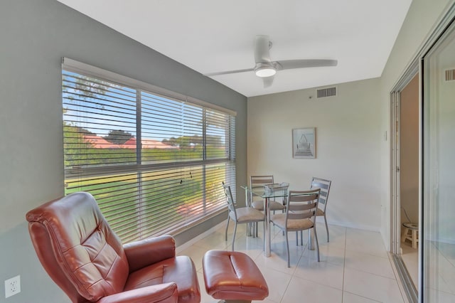 5876 Regal Glen Dr Unit 103, Boynton Beach, FL 33437 - dining room featuring a ceiling fan, light tile patterned floors, and baseboards