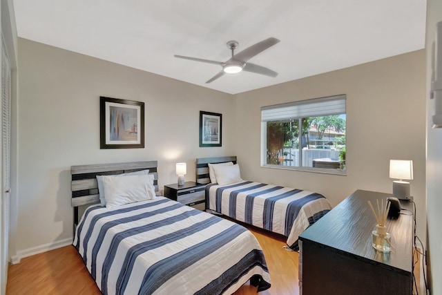 5876 Regal Glen Dr Unit 103, Boynton Beach, FL 33437 - bedroom with light wood-style flooring, baseboards, and a ceiling fan