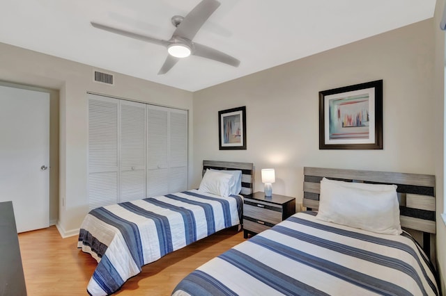 5876 Regal Glen Dr Unit 103, Boynton Beach, FL 33437 - bedroom featuring a closet, light wood-style floors, a ceiling fan, and baseboards