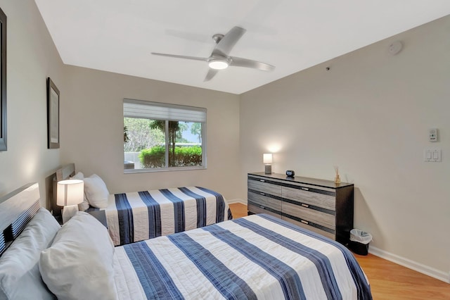 5876 Regal Glen Dr Unit 103, Boynton Beach, FL 33437 - bedroom with light wood finished floors, baseboards, and a ceiling fan