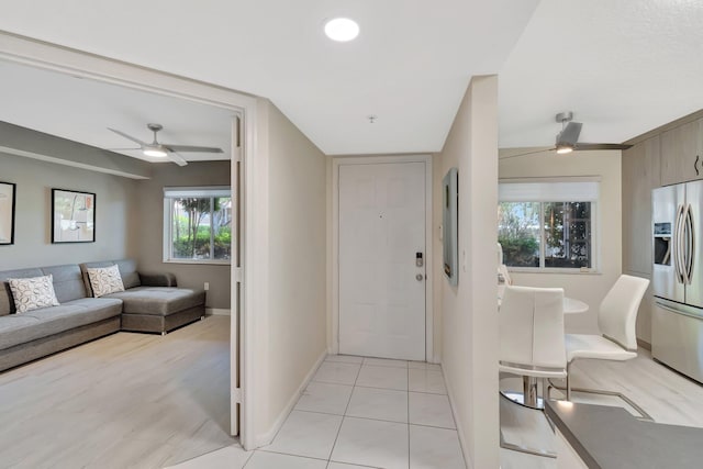 5876 Regal Glen Dr Unit 103, Boynton Beach, FL 33437 - entrance foyer featuring ceiling fan, baseboards, and light tile patterned flooring