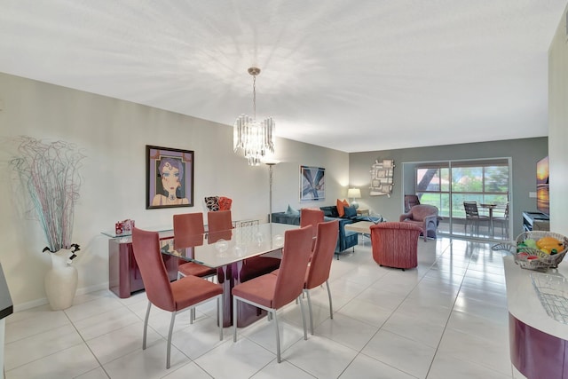 5876 Regal Glen Dr Unit 103, Boynton Beach, FL 33437 - dining room featuring a chandelier and light tile patterned floors