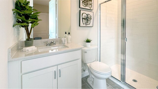 1169 SE Crosswood Way, Port Saint Lucie, FL 34984 - bathroom featuring a stall shower, toilet, and vanity