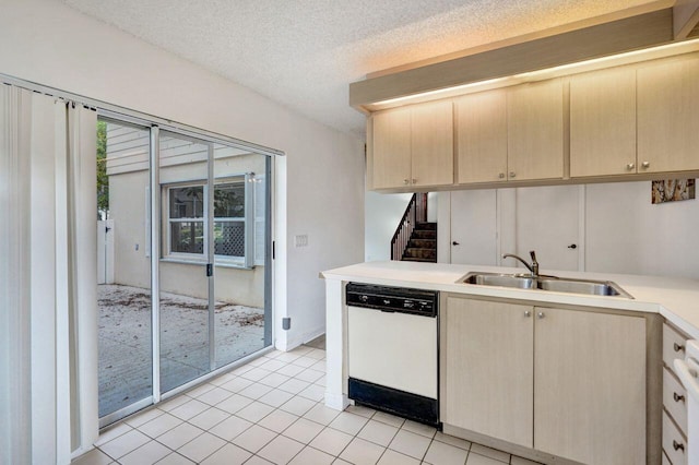 8155 Chelsea Ct Unit 55A, West Palm Beach, FL 33406 - kitchen featuring white dishwasher, a sink, light brown cabinets, light countertops, and light tile patterned floors