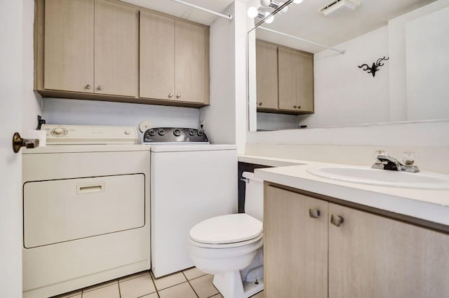 8155 Chelsea Ct Unit 55A, West Palm Beach, FL 33406 - bathroom featuring washing machine and dryer, vanity, toilet, and tile patterned flooring