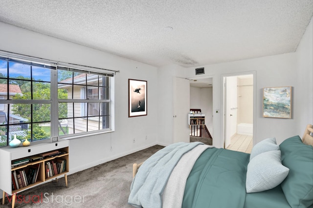 8155 Chelsea Ct Unit 55A, West Palm Beach, FL 33406 - carpeted bedroom with a textured ceiling, baseboards, and ensuite bathroom