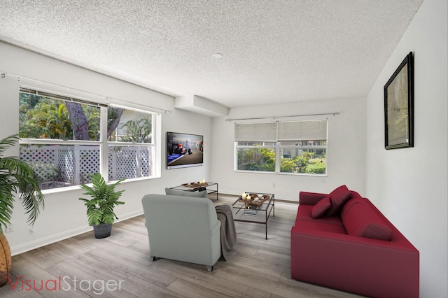 8155 Chelsea Ct Unit 55A, West Palm Beach, FL 33406 - living area with a textured ceiling, wood finished floors, healthy amount of natural light, and baseboards