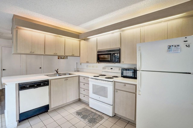 8155 Chelsea Ct Unit 55A, West Palm Beach, FL 33406 - kitchen with white appliances, a sink, light brown cabinetry, light countertops, and a peninsula