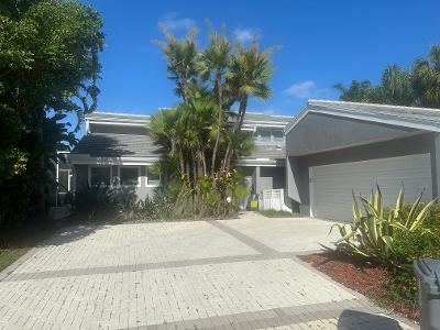 7716 Cedarwood Cir, Boca Raton, FL 33434 - view of front of home featuring decorative driveway and an attached garage