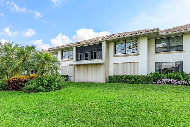 10739 Quail Covey Rd Azalea, Unit Azalea, Boynton Beach, FL 33436 - back of house with stucco siding, a yard, and a tile roof