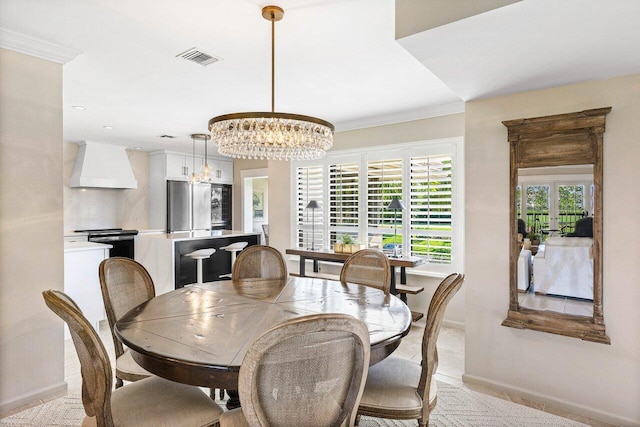 10739 Quail Covey Rd Azalea, Unit Azalea, Boynton Beach, FL 33436 - dining room featuring a chandelier, baseboards, and crown molding