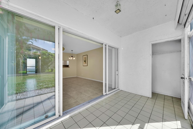 719 Lori Dr Unit 102, Palm Springs, FL 33461 - unfurnished sunroom with a chandelier