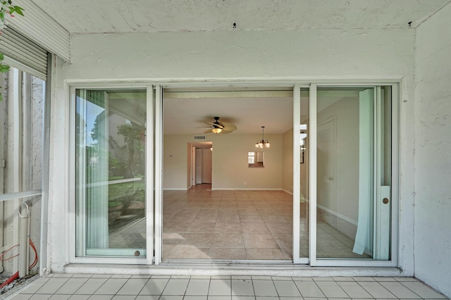 719 Lori Dr Unit 102, Palm Springs, FL 33461 - unfurnished sunroom with healthy amount of natural light and a chandelier