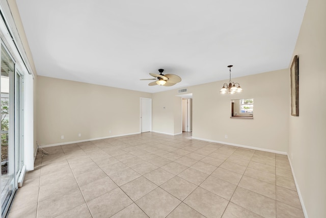 719 Lori Dr Unit 102, Palm Springs, FL 33461 - spare room featuring a ceiling fan, a chandelier, light tile patterned floors, and baseboards