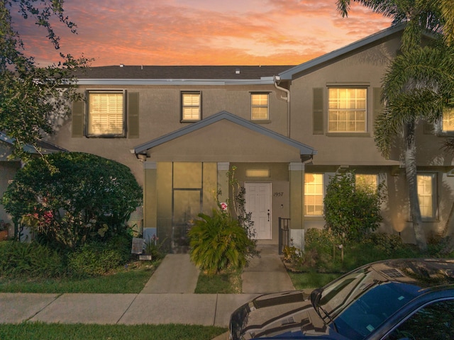 1957 SE Avon Park Dr, Port Saint Lucie, FL 34952 - view of front facade with stucco siding