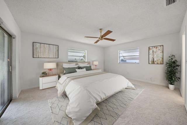22602 SW 54th Way, Boca Raton, FL 33433 - bedroom featuring light carpet, a textured ceiling, a ceiling fan, and baseboards