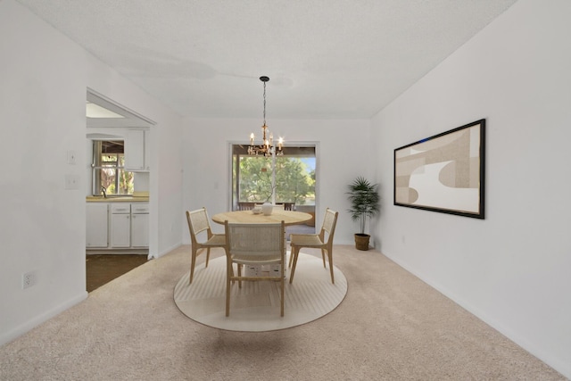 22602 SW 54th Way, Boca Raton, FL 33433 - dining space with a chandelier, carpet flooring, and healthy amount of natural light