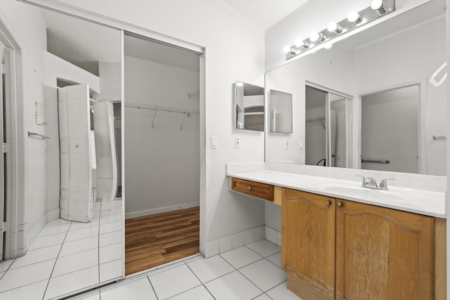 5618 Kingsmill Ct, Greenacres, FL 33463 - bathroom featuring tile patterned flooring, vanity, and a spacious closet