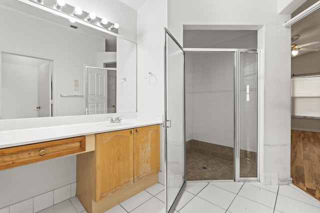 5618 Kingsmill Ct, Greenacres, FL 33463 - full bath featuring a stall shower, ceiling fan, vanity, and tile patterned flooring