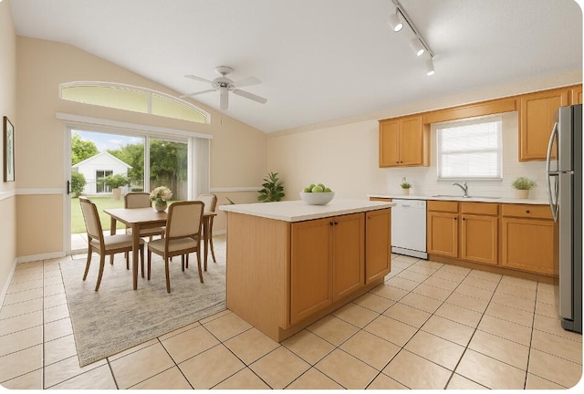 5618 Kingsmill Ct, Greenacres, FL 33463 - kitchen featuring white dishwasher, freestanding refrigerator, a sink, lofted ceiling, and a ceiling fan