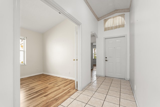 5618 Kingsmill Ct, Greenacres, FL 33463 - entryway featuring baseboards, light wood finished floors, and arched walkways