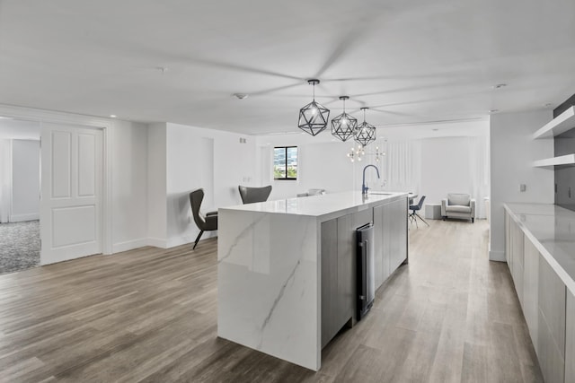 100 N Federal Hwy Unit 1004, Fort Lauderdale, FL 33301 - kitchen featuring modern cabinets, open floor plan, light wood-type flooring, and decorative light fixtures