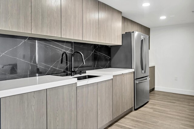 100 N Federal Hwy Unit 1004, Fort Lauderdale, FL 33301 - kitchen featuring modern cabinets, light brown cabinets, a sink, baseboards, and light countertops