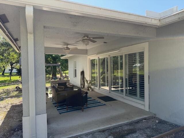 15741 97th Rd N, West Palm Beach, FL 33412 - view of patio featuring a ceiling fan and outdoor lounge area