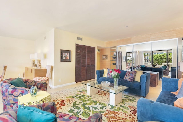 3300 S Ocean Blvd Unit 101S, Palm Beach, FL 33480 - living room featuring light tile patterned floors and baseboards