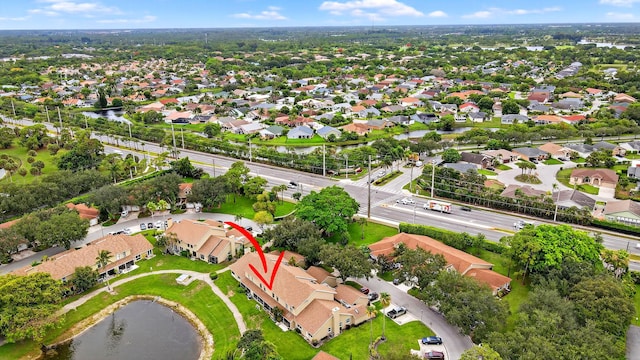 2703 Maplewood Dr, Greenacres, FL 33415 - aerial view of property and surrounding area featuring nearby suburban area and a large body of water