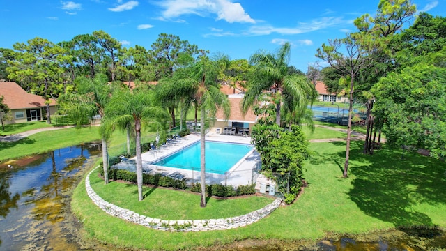 2703 Maplewood Dr, Greenacres, FL 33415 - community pool with a yard and view of scattered trees