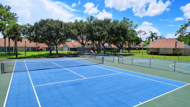 2703 Maplewood Dr, Greenacres, FL 33415 - view of tennis court featuring community basketball court