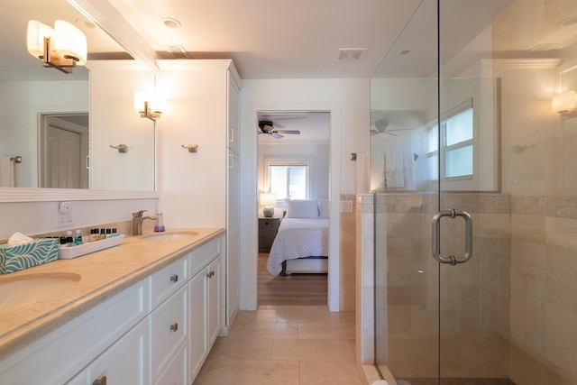 1809 Surfside Dr, Fort Pierce, FL 34949 - full bath with ceiling fan, double vanity, connected bathroom, a shower stall, and tile patterned flooring