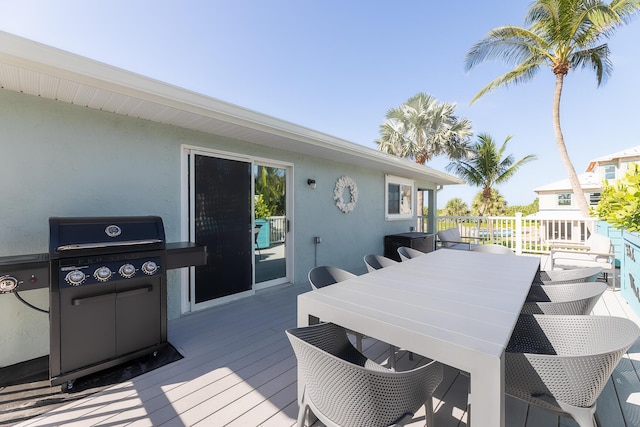1809 Surfside Dr, Fort Pierce, FL 34949 - wooden terrace with grilling area and outdoor dining space