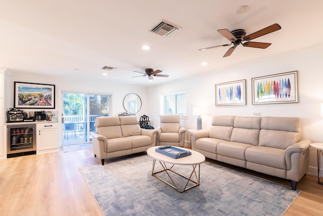 1809 Surfside Dr, Fort Pierce, FL 34949 - living area with wine cooler, a ceiling fan, plenty of natural light, recessed lighting, and ornamental molding