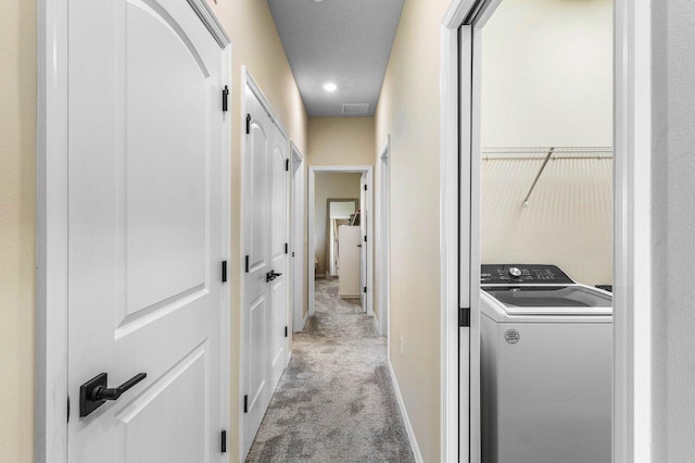 4858 Blistering Way, Lake Worth, FL 33467 - laundry area with washer / dryer, light carpet, and baseboards