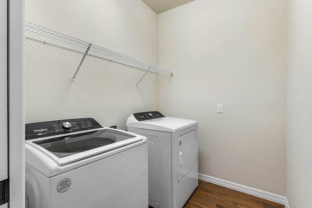 4858 Blistering Way, Lake Worth, FL 33467 - laundry area featuring washing machine and dryer, baseboards, and dark wood-type flooring