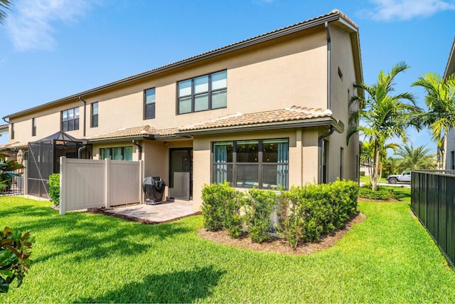 4858 Blistering Way, Lake Worth, FL 33467 - rear view of property featuring stucco siding, a tile roof, and a patio area