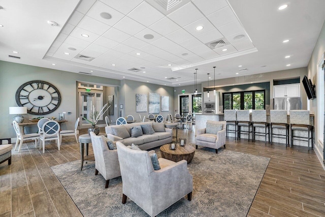 4858 Blistering Way, Lake Worth, FL 33467 - living area featuring a tray ceiling, wood finished floors, baseboards, and a drop ceiling