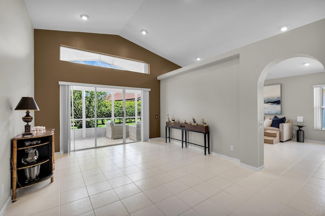 6563 Kings Creek Ter, Boynton Beach, FL 33437 - empty room featuring arched walkways, plenty of natural light, high vaulted ceiling, recessed lighting, and tile patterned flooring