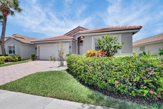 6563 Kings Creek Ter, Boynton Beach, FL 33437 - mediterranean / spanish home featuring stucco siding, a tile roof, and decorative driveway